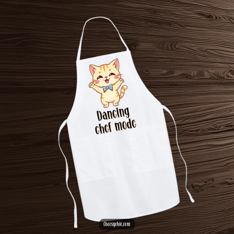 Funny apron showing a cute cat character wearing a tiny bow tie and performing a silly, jubilant dance.