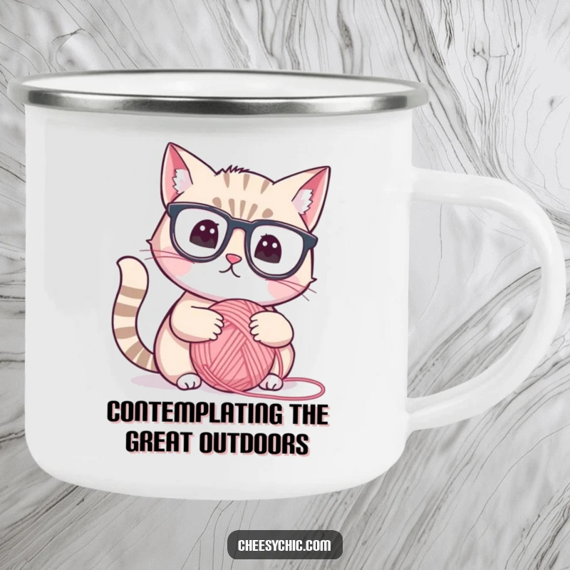 Funny camping mug with a cute cat in reading glasses, thoughtfully observing a yarn ball, durable and humorous outdoor gear.