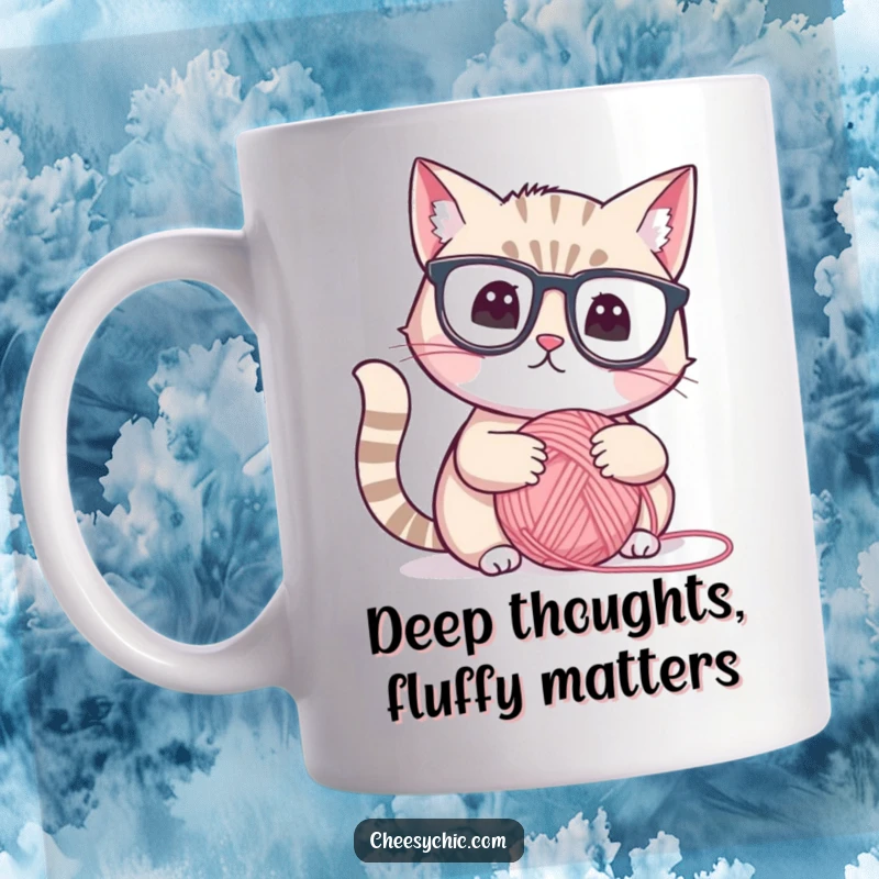 Funny mug of a cute cat wearing reading glasses, looking thoughtfully at a yarn ball, intellectual and humorous.