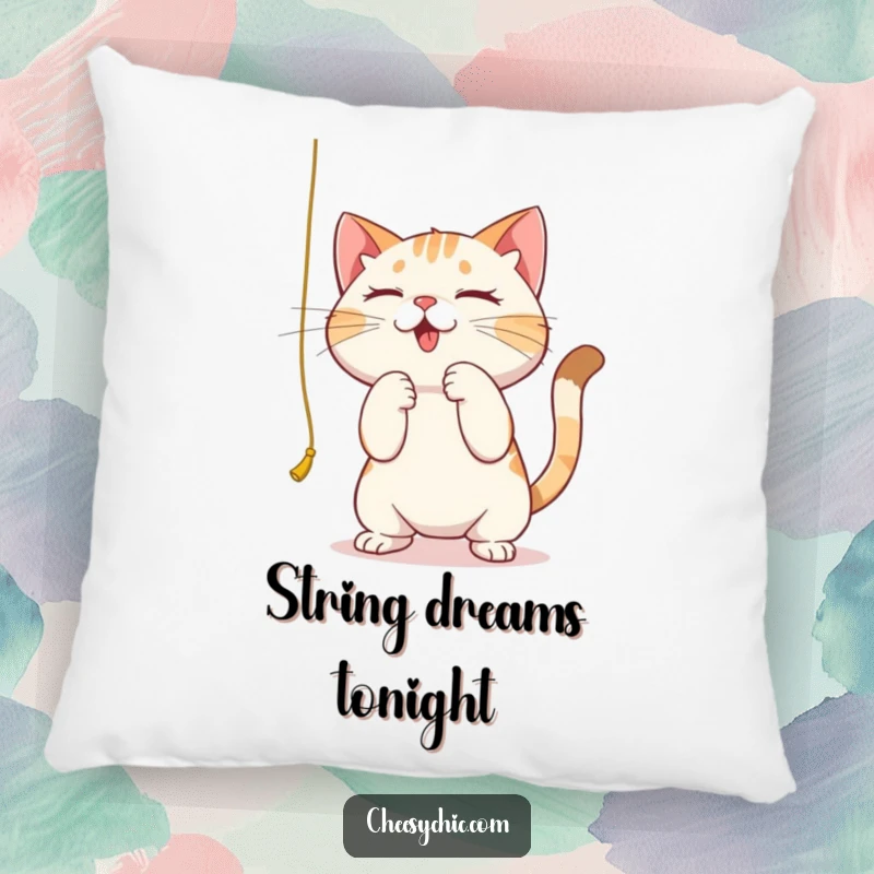 Funny pillow featuring a cute cat intensely batting at a dangling string, plush and humorous focus.