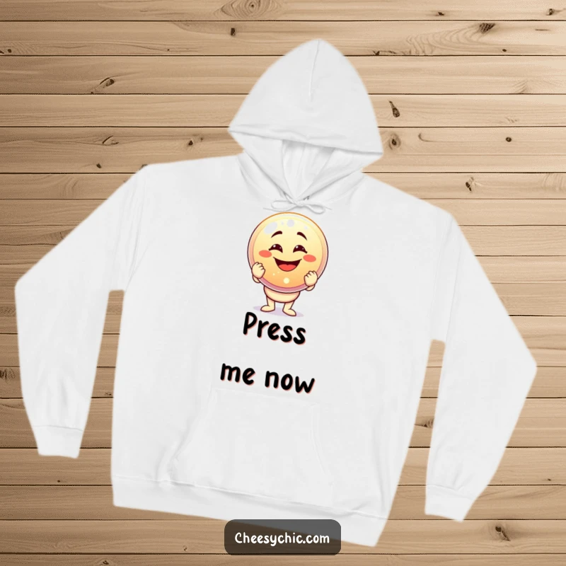 Funny hoodie featuring a character with a massive goofy grin holding a giant, sparkling button, symbolizing accomplishment and joy.