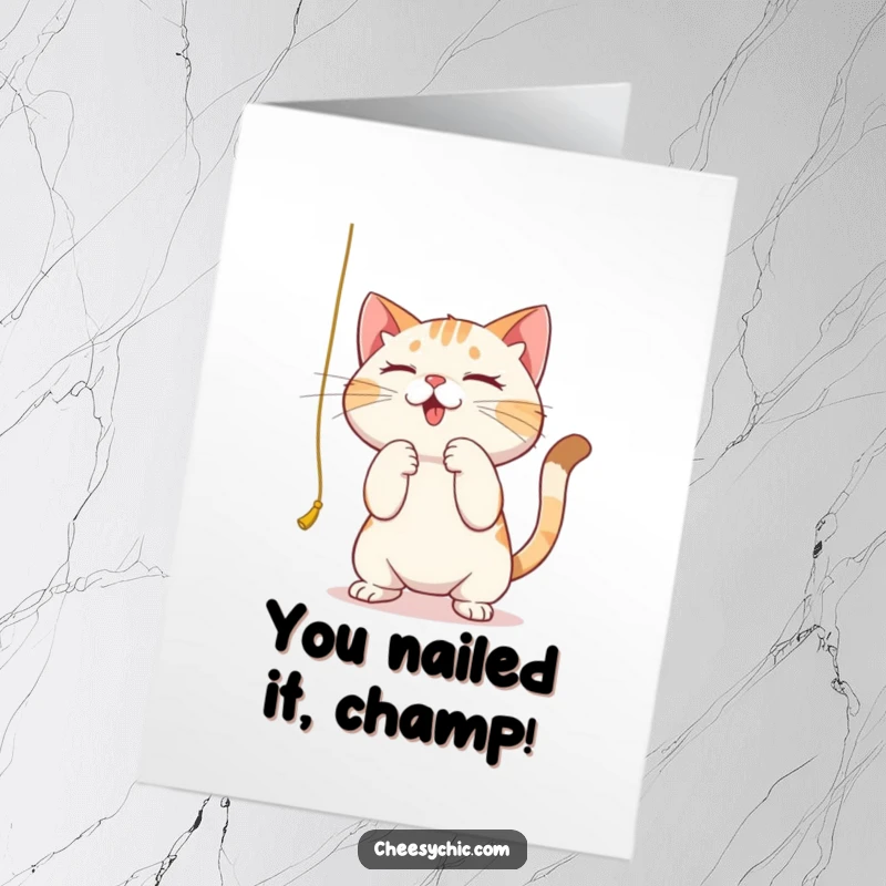 Funny Free Printable Congratulations Card: A cat with intense focus bats at a hanging string, marking an achievement.