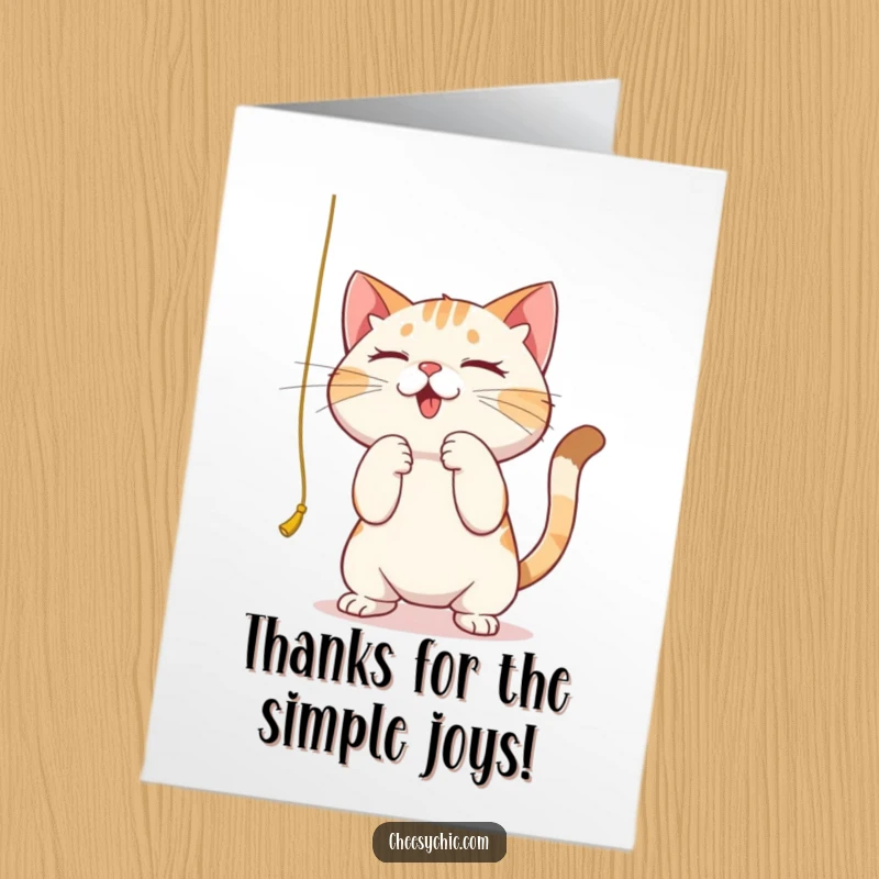 Funny Free Printable Thank You Card: A cat intently bats at a dangling string, conveying thanks.