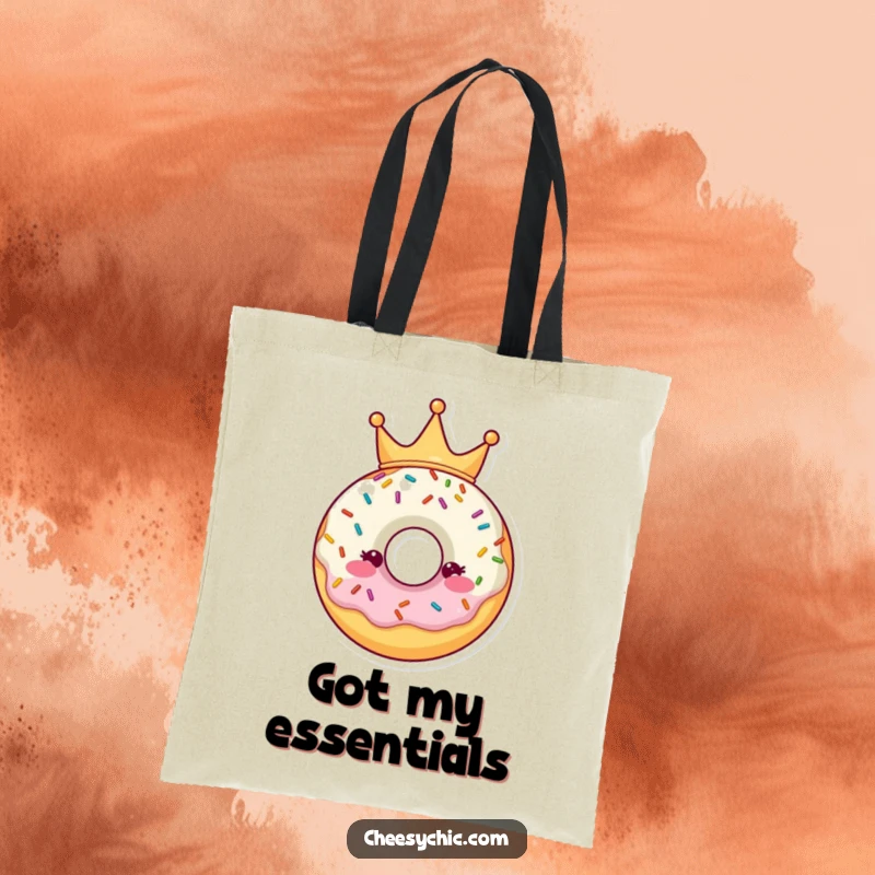 Funny Tote Bag showcasing a cute donut character wearing a sprinkle crown, a charming and humorous accessory.